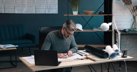 Attractive Architect working at his Modern Office with pencil and Ruler.  Stock Footage 126243643