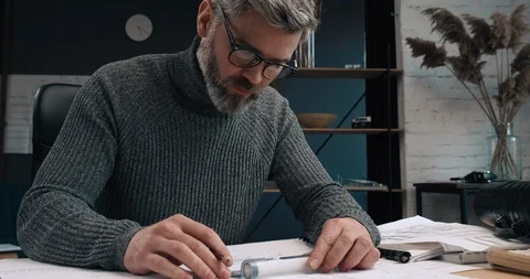Attractive Architect working at his Workplace with pencil and Ruler. Stock Footage 126245319