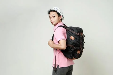 Attractive asian man backpacker back pose portrait. travelling concept. on is Stock Photos
