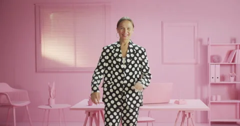 Attractive authentic female smiling standing at modern pink office trendy style Stock Footage 162415145
