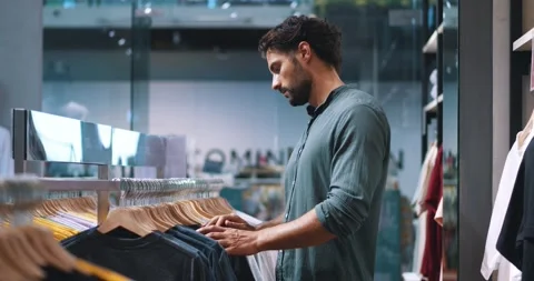 Attractive bearded multi-ethnic macho man in dark-green casual shirt, shopping Stock Footage 219198404