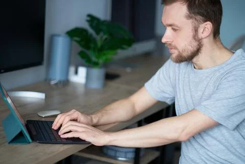 Attractive bearded programmer or software developer working in office Foto stock