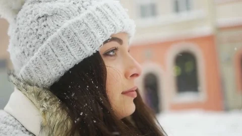 Attractive beautiful lady posing and flirting on camera over snowy city Stock Footage 69922104