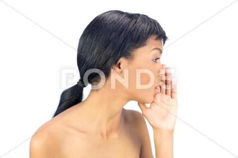 Attractive black haired woman whispering a secret Stock Photos