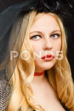 Attractive blonde in a black veil Stock Photos