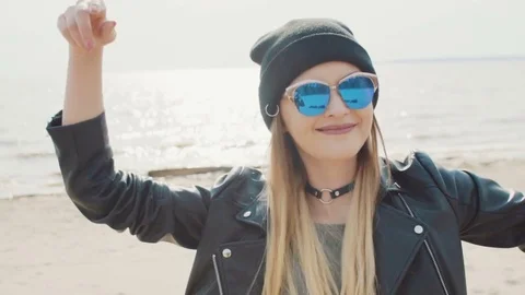 Attractive blonde dancing and smiling at the seaside slow motion close-up Video stock 75693075
