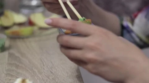 Attractive blonde eats sushi at home Video stock 64359629