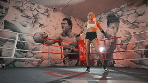Attractive blonde female dancing inside a boxing ring 4K Video stock 227261902