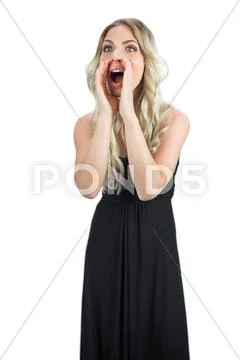 Attractive blonde wearing black dress shouting Stock Photos