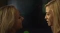 Attractive blonde women dancing and making out with each other in nightclub HD Footage