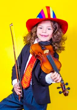 Attractive boy playing violin, studio shooting, music concept Stock Photos