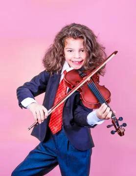 Attractive boy playing violin, studio shooting, music concept 스톡 사진