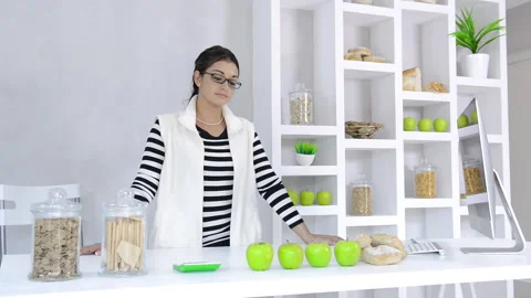 Attractive brunette lab technician working with technology in the study of nutri Stock Footage 199629277