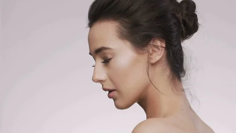 Attractive brunette model at studio background Stock Footage 92520319