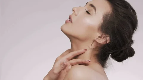 Attractive brunette model at studio background Stock Footage 92520573