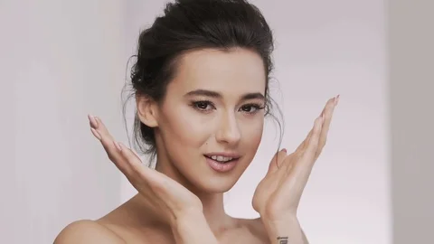 Attractive brunette model at studio background Stock Footage 92521581