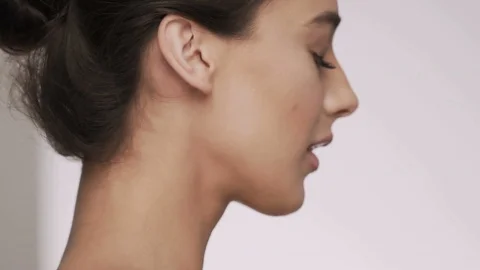 Attractive brunette model at studio background Video stock 92524151