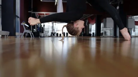 Attractive brunette is practicing classical yoga in modern studio. Video stock 85426091
