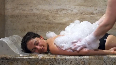 young woman relaxing and takes bubble bath in bathtub with foam, People  Stock Footage ft. woman & bath - Envato Elements