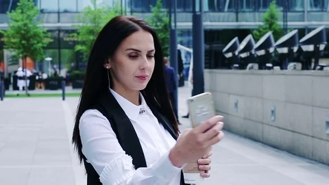 Attractive brunette taking selfies Stock Footage 76980230