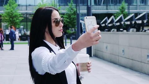 Attractive brunette taking selfies 動画素材 76980587