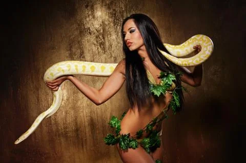 Attractive brunette woman with python Stock Photos