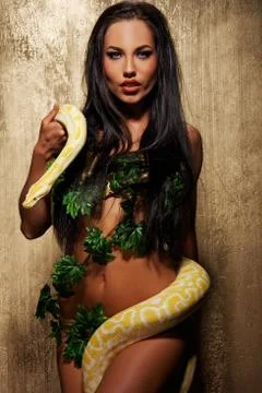 Attractive brunette woman with python Stock Photos
