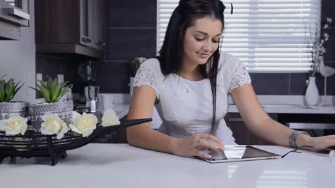 Attractive brunette woman using tablet computer retail internet surfing. Видео 199629122