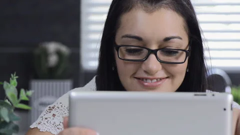 Attractive brunette woman using tablet computer retail internet surfing. 스톡 동영상 199629123