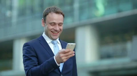 Attractive business man using app on smart phone 動画素材 68385436