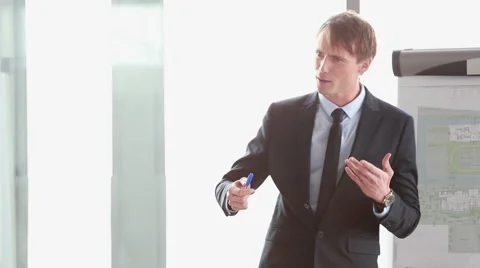 Attractive businessman giving presentation Stock Footage 59542226