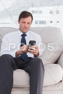 Attractive businessman typing text message Stock Photos