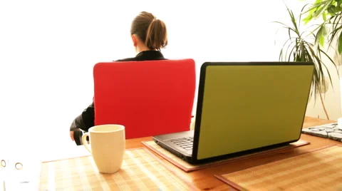 Attractive businesswoman on rotating chair smiling to the camera Stock Footage