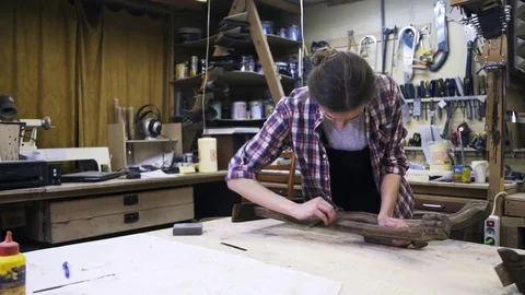 Attractive carpenter is restoring the wood element of some furniture. 스톡 동영상 72286568