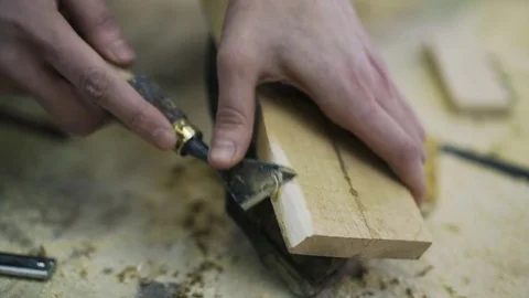 Attractive carpenter is restoring the wood element of some furniture. Stock Footage 72287757