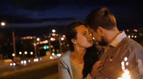 Attractive casually dressed couple enjoy a romantic stroll alongside the city Stock Footage 65472161