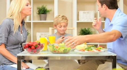 Attractive Caucasian Family Eating Together Stock Footage