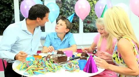 Attractive Caucasian Family Enjoying Birthday Cake Stock Footage