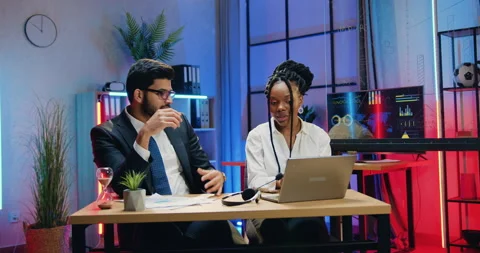 Attractive confident experienced stylish diverse businesspeople working together Stock Footage 166703517
