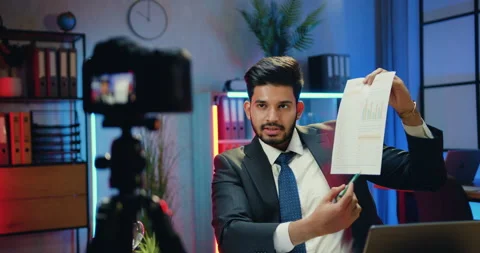 Attractive confident high-skilled purposeful bearded businessman recording video Stock Footage 166553351