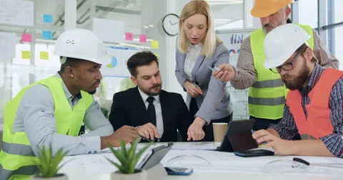 Attractive confident industrious multiethnic group of engineers working together Stock Footage 145802341
