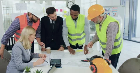 Attractive confident professional multiracial team of engineers of building Stock Footage 145611324