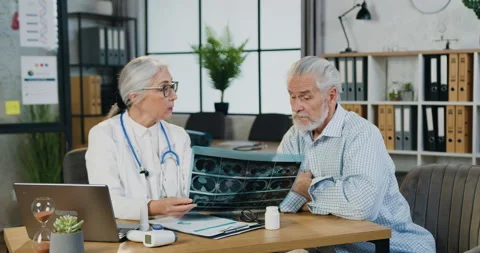 Attractive confident respected skilled grey-haired woman-doctor explaining Stock Footage 160811283