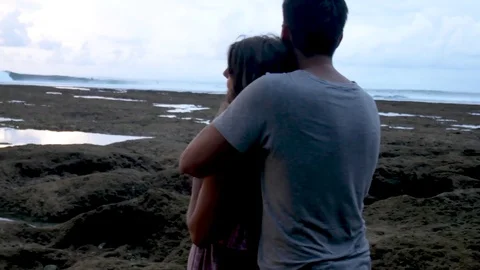 Attractive Couple Hugging During Sunset Near the Ocean. Honeymoon. Stock Footage 82464349