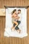 The attractive couple sleeping on the bed. View from above Photo