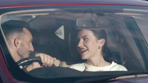 The attractive couple talking inside a car. slow motion Stock Footage 137481499