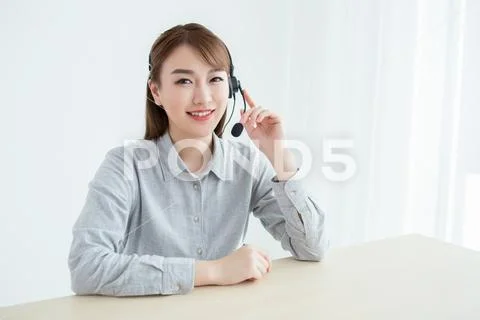Attractive customer servicer working in office Stock Photos