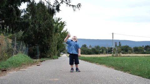 Attractive Cute Young Child Boy Running With Fun Show with finger Up Stock Footage 114014727