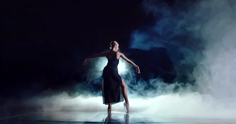 An attractive dancer raises her hands up Stock Footage 154056258