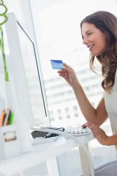 Attractive designer purchasing online Stock Photos